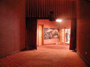 The north hall, with the curtains open.  A banner for 'Atlantis' hangs between the projection room door and the lobby french doors. - , Utah
