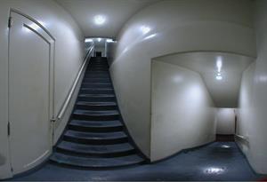 A panorama of the landing on the north stairs.  On the left is a door into a room with a cooling fan and an unfinished area above the lobby. - , Utah