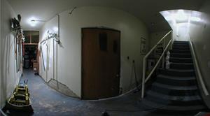 A panorama at the bottom of the south stairs.  Cleaning supplies are stored on the left.  A door in the middle leads to the hall between the lobby and auditorium. Stairs on the left ascend to the projection booth. - , Utah