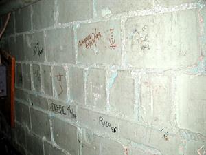 Several names are written on cinderblock. Dates range from 1987 to 2000. - , Utah