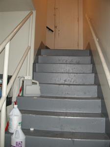 Stairs up from the south hall to the projection booth.  At the landing is a door to a storage area. - , Utah