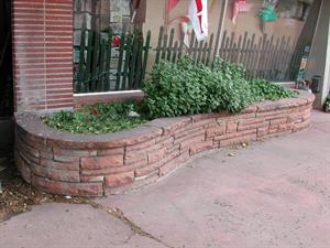 The flagstone planter box on the left side of the Apple Yard Art entrance. - , Utah