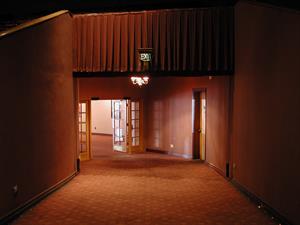 The hall to the lobby.  The drapes which hung below the Exit sign were removed during the week before the theater closed. - , Utah