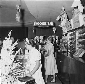 Three women work behind the counter of the concession stand in 1958. - , Utah