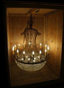 A chandalier hangs from the top of the wooden box that protects us. - , Utah