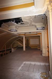 Looking north across the mezzanine, with a section of the floor cut out in the lower right. Damage from the escalator is also visible in the ceiling in the upper left. - , Utah