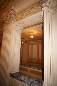Decorative pillars frame an opening, with marble topping a railing below and multiple levels of decorative scrollwork above. - , Utah