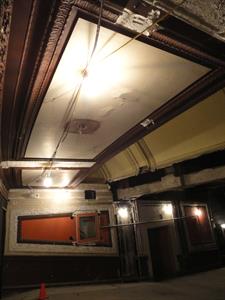 Looking across the back of the lower auditorium, with a view of two white panels on the ceiling with dark, ornate borders. - , Utah