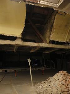 A section of curved ceiling was removed below where an escalator was installed in 1968.  In the lower right is a pile of rubble from the demolished projection booth. - , Utah