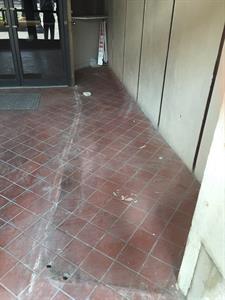 Looking through an entrance door at the floor where marks on the floor indicate the former location of the ticket booth. - , Utah
