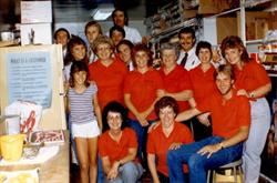 Employees pose for a photo in the back store room.