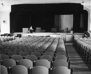 College Hall after its1930 remodel into a theater-style auditorium with sloped seating and permanent proscenium arch.