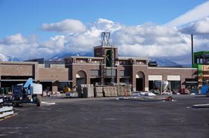 Looking across the parking lot at the front of the theater.  An unfinished two-tier tower stands over the entrance. - , Utah