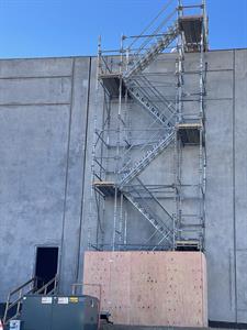 Scaffolding and stairs at the north end of the east exterior wall. - , Utah