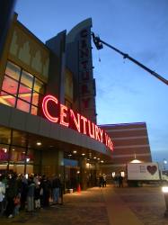 Workers prepare to turn on the theater's sign.
