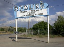 This sign was most likely used originally by the theater.  A bowling alley was built on what may have been the back have of the drive-in.
