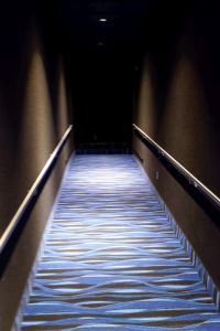 After passing through the auditorium door, a short hallway slopes up, with a right turn at the end. - , Utah