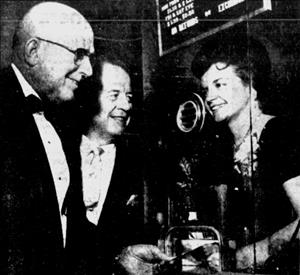 "Gov. George D. Clyde and Edward F. Nauman, Thiokol vice president, obtain 'Mad, Mad, Mad, Mad World' tickets from Mrs. Grant Clyde of Villa Heart Fund." - , Utah