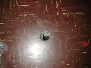 When the projector was installed, a hole was cut in the floor to connect a pipe from the room below. - , Utah