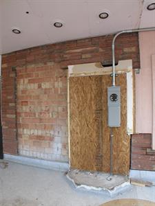 A temporary power connection on the boarded up doorway of the Villa Theatre's ticket booth.  The temporary connection was made after power poles were removed from of the north side of the building. - , Utah