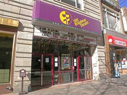 On the left of the theater entrance is an information sign for a walking tour of downtown Salt Lake. - , Utah