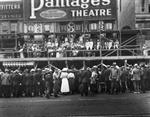 A crowd gathers around scaffolding for the New Pantages Theatre. - , Utah