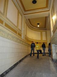 Members of the Utah Heritage Foundation tour use the ramp to access the mezzanine. - , Utah