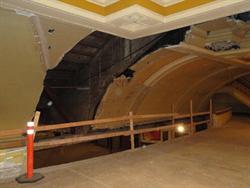 A hole is left in curved ceiling, where the escalator once stood. - , Utah