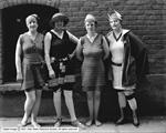 Four actresses in a production at the Pantages pose in bathing suits outside the theater. - , Utah