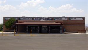 The front of the Red Cliffs Cinemas.  Along the top of the building is the name of the theater and an attraction board for each auditorium.