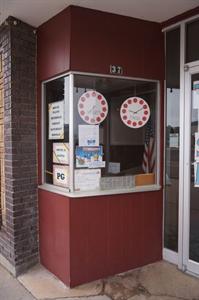 Movie start and end times are displayed in the window of the ticket booth. - , Utah