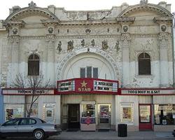 'Before,' April 2006, shows bare wood, missing pieces, flaking paint,  crumbling stucco, and the old marquee. - , Utah