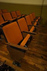 The auditorium seats came from a university and still have a fold-out table, which some moviegoers use to hold their concession items. - , Utah