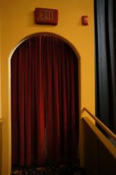 A curtained entry on the left side of the stage. - , Utah
