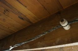 Old electrical wiring with a porcelain insulator. - , Utah