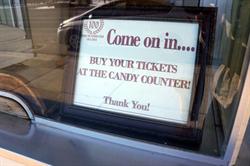 A signed in the ticket window, "Come on in...  Buy your tickets at the candy counter!" - , Utah