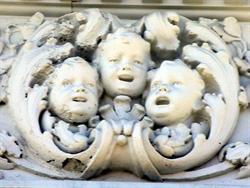 Faces of three singing cherubs. - , Utah