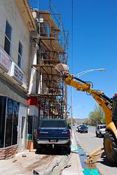 A back-hoe stabilizes the scaffolding. - , Utah