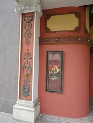 A decorative column and narrow poster case, on the left side of the entrance. - , Utah