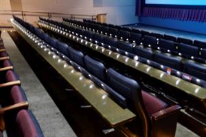 All rows, except the first, have a narrow table attached to the back of the seats in front. - , Utah