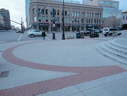 A circular pattern of red brick pays homage to the original location of the Centre Theatre's sign and ticket booth. - , Utah