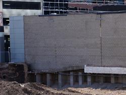 The slope of one of the auditoriums can be seen during excavation for a new building to the north of the theater. - , Utah