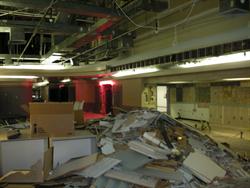 Debris begins to pile up in the center of the lobby after demolition of the interior begins. - , Utah