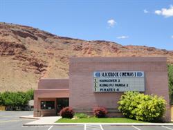 <font size='2'>The Slickrock Cinemas 3, with the mountain in the background.</font> - , Utah