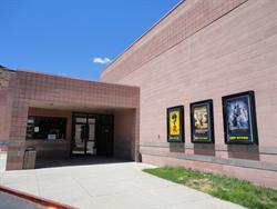 Three poster cases greet moviegoers as they approach the theater entrance. - , Utah
