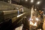 Workers prepare to install new seating in the IMAX theater at the Clark Planetarium. - , Utah