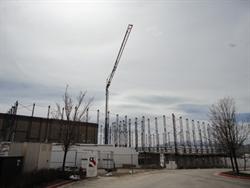A crane above the rising walls of two auditoriums at the northwest corner of the existing building. - , Utah