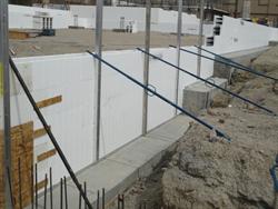 Poles help hold up the framing for a wall before the concrete is poured. - , Utah