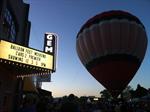 A crowd awaits the releasing of a hot-air balloon in front of the Gem Theatre. - , Utah