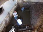 Pouring the concrete floor for the new green room. - , Utah
